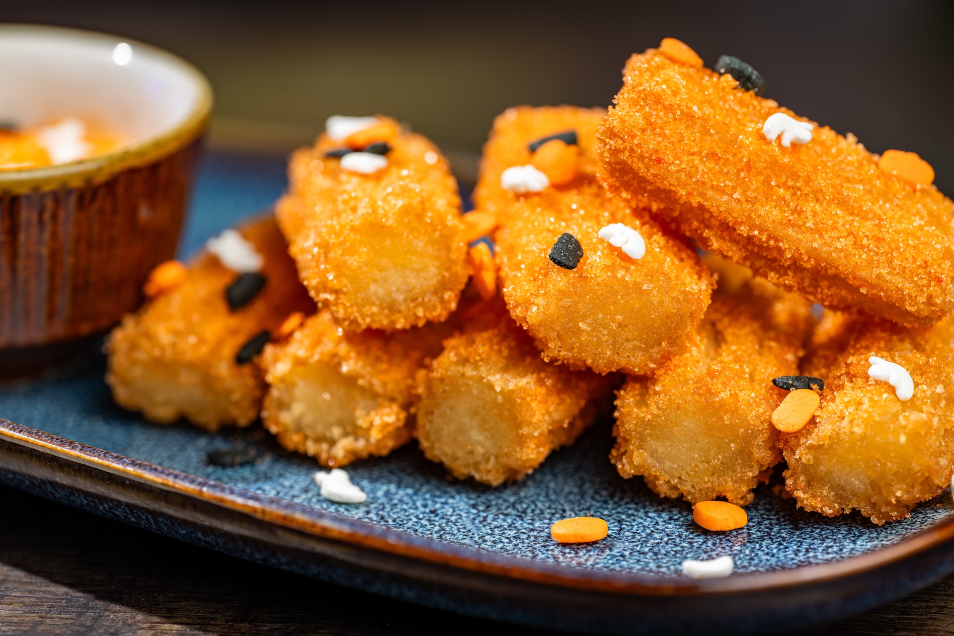 Pumpkin Patch Mini Churros rolled in orange sugar and served with pumpkin cheesecake dip (Available during Mickey&rsquo;s Not-So-Scary Halloween Party only)