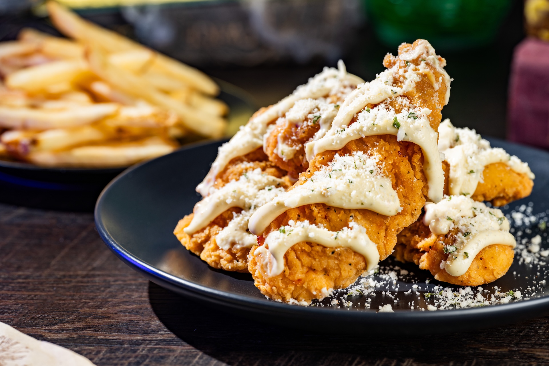 Undead Garlic-Parmesan Chicken Strips with garlic-Parmesan sauce, parsley, and served with french fries (Available during Mickey&rsquo;s Not-So-Scary Halloween Party only)