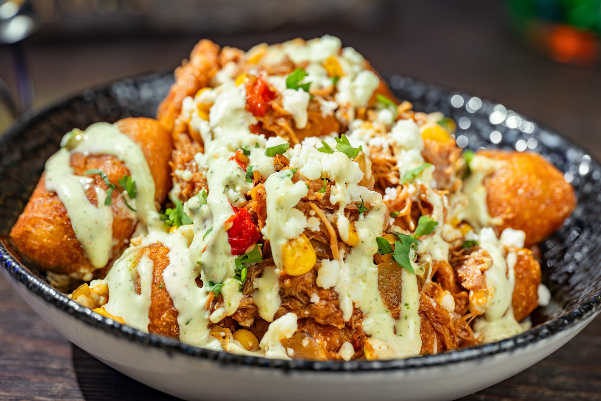 Chipotle Barbecue Pork and Street Corn Mini Corn Dogs: Mini corn dogs topped with fire-roasted corn, queso fresco, jalape&ntilde;o ranch, and cilantro (Available during Mickey&rsquo;s Not-So-Scary Halloween Party only)