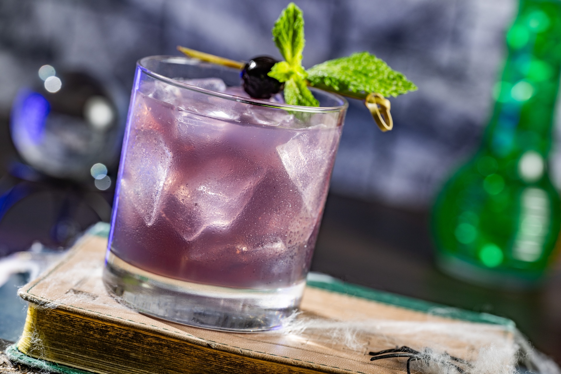 Violet Specter: Tito&rsquo;s Handmade Vodka, Chambord Liqueur, lemon juice, and Sprite, garnished with mint and a Luxardo cherry