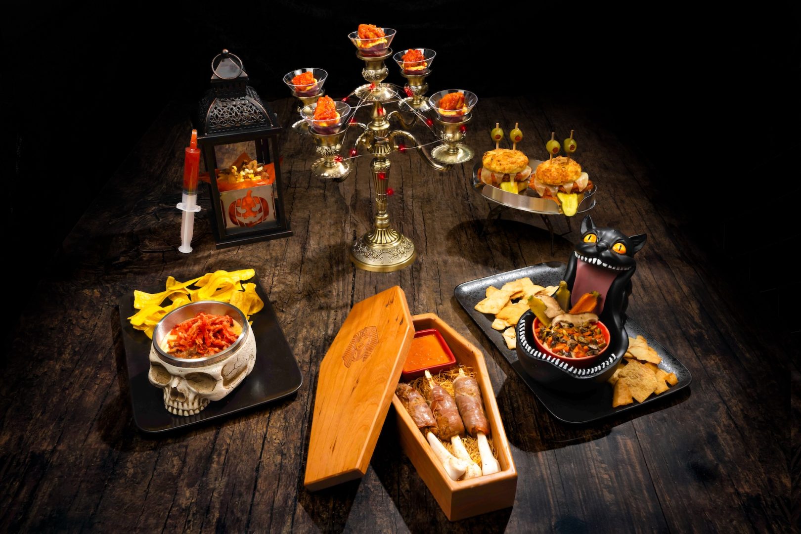 Halloween-themed food display featuring unique dishes and decorations.