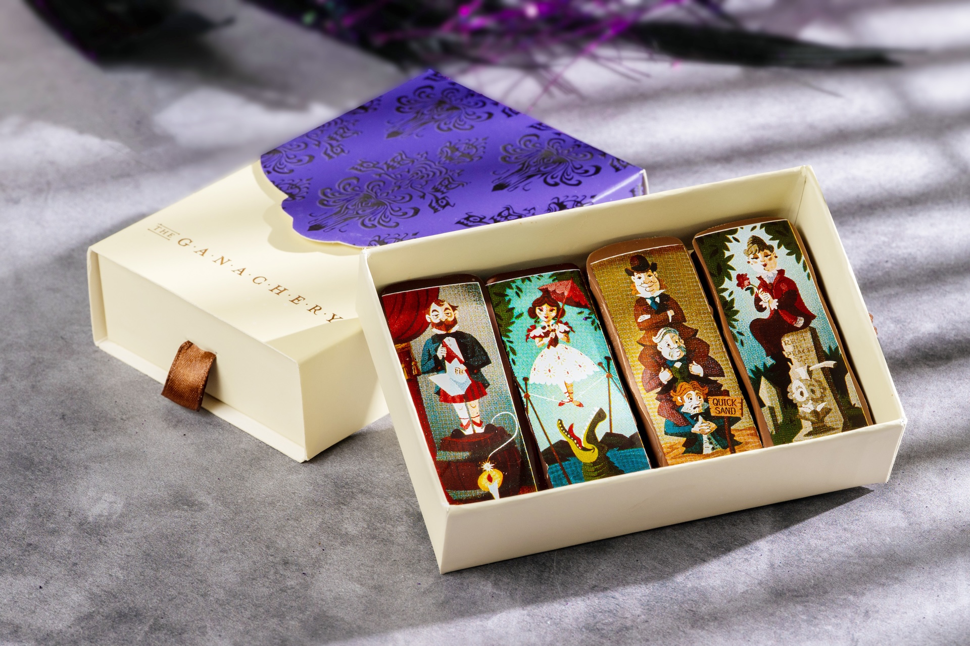 Haunted Mansion Portrait Bars: Four chocolate ganache bars with flavors of chipotle, raspberry, salted caramel, and passion fruit