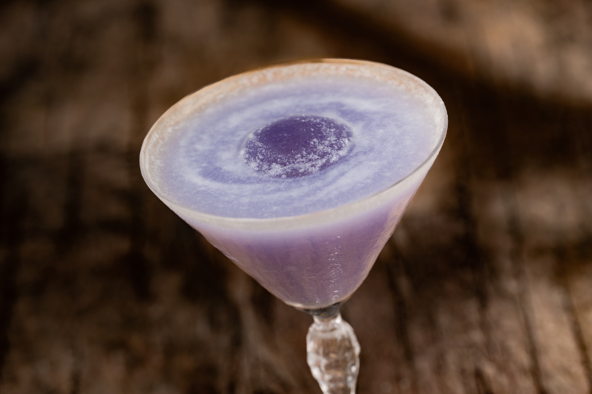 Midnight Relic: Tito&rsquo;s Handmade Vodka, ube syrup, cream of coconut, lemon juice, and a pinch of edible glitter (New)