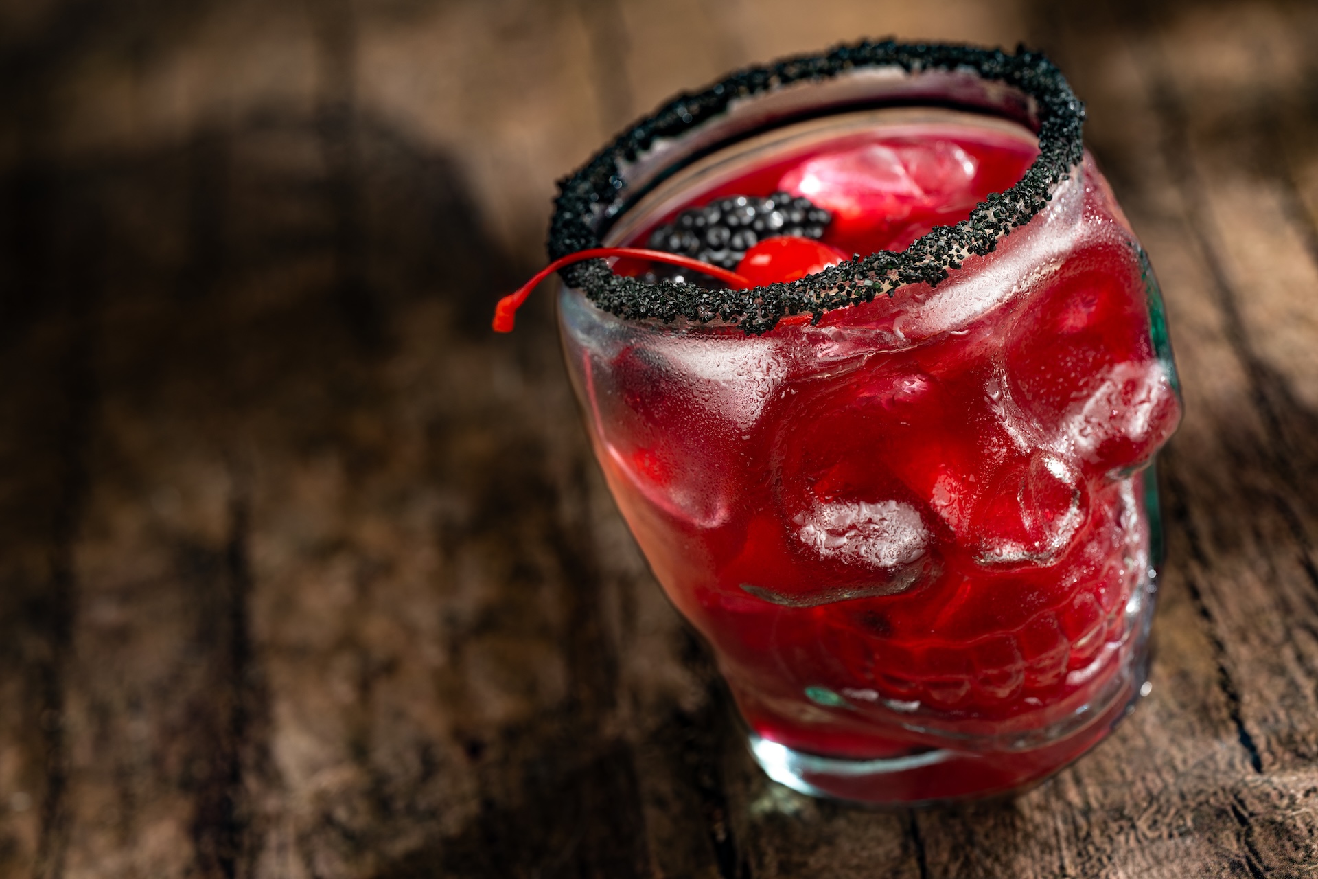 Temple of Doom Margarita: Patr&oacute;n Silver Tequila, Bols Blackberry Brandy, blackberry pur&eacute;e, habanero-lime syrup, and lime juice topped with a black sugar rim, blackberries, and cherries (New)