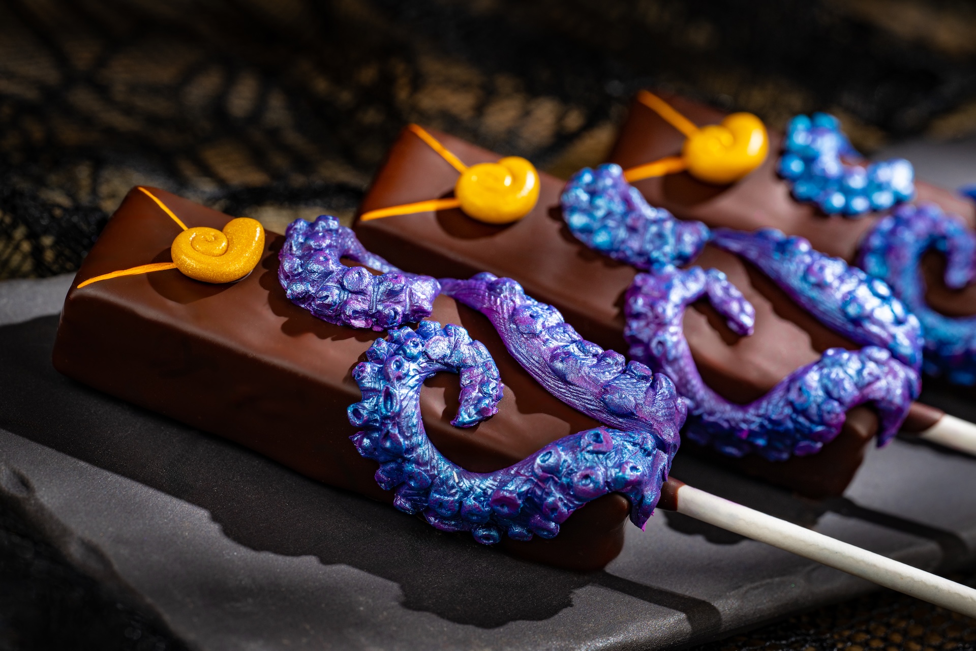 Ursula Dark Berry Ganache Pop: Blackberry ganache with cassis and vanilla covered in dark chocolate (New)