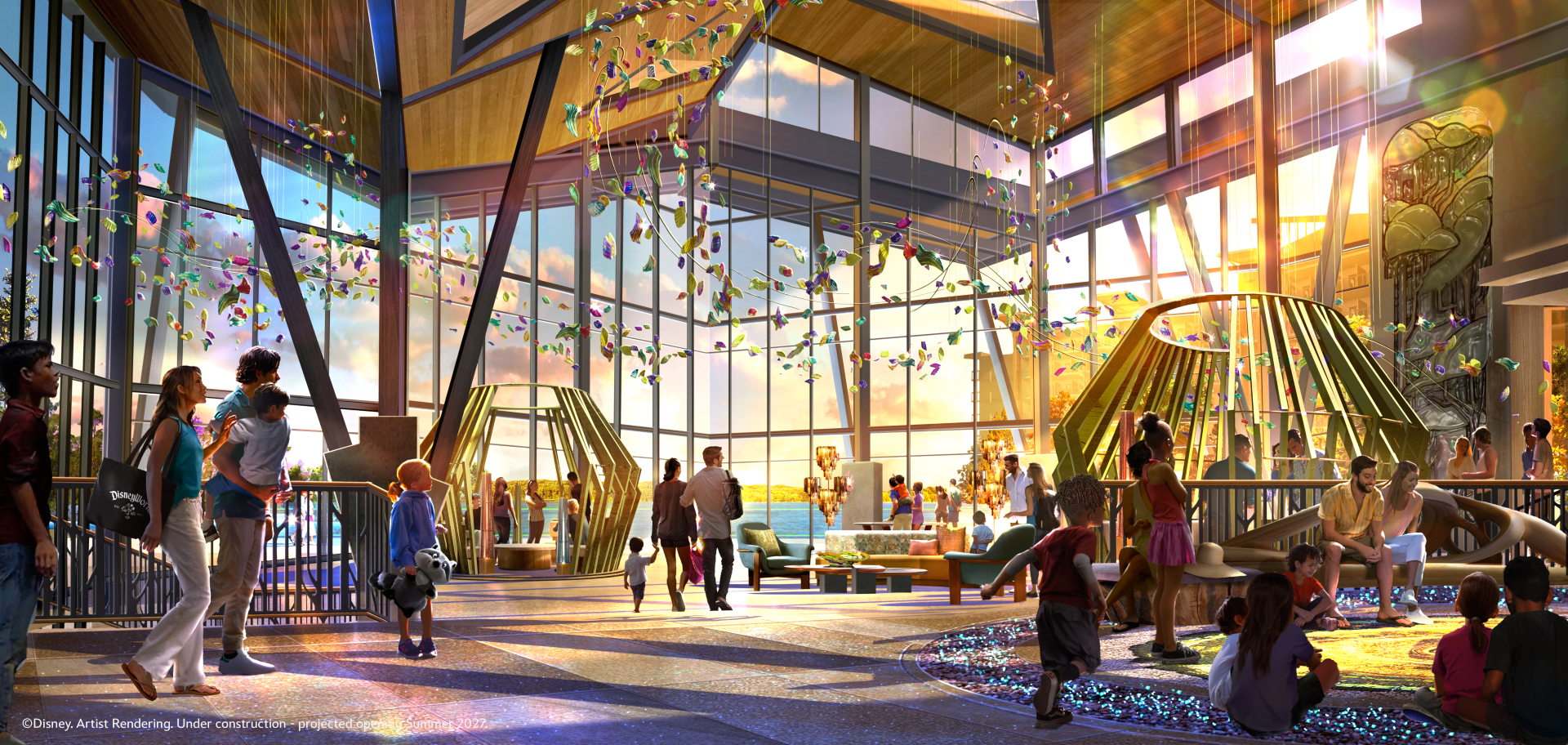 Bright lobby with large windows, colorful decorations, and families interacting.