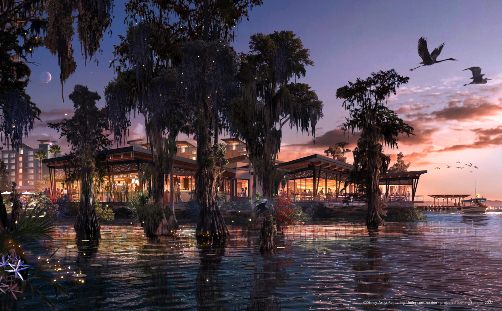 Lakeside resort with modern architecture, surrounded by trees and water at sunset.