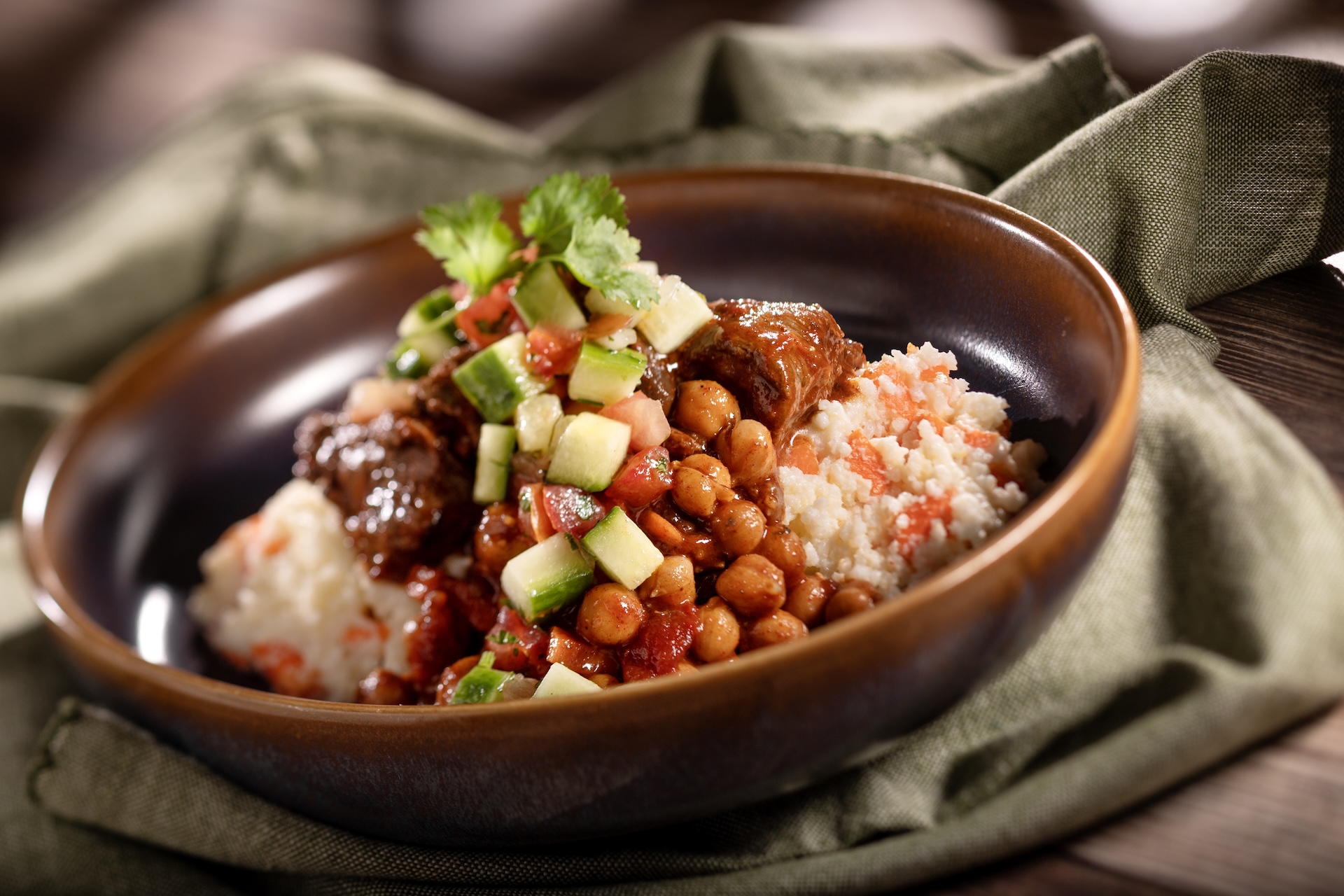 Berbere-spiced Beef Stew with sweet potato mealie pap and kachumbari slaw  