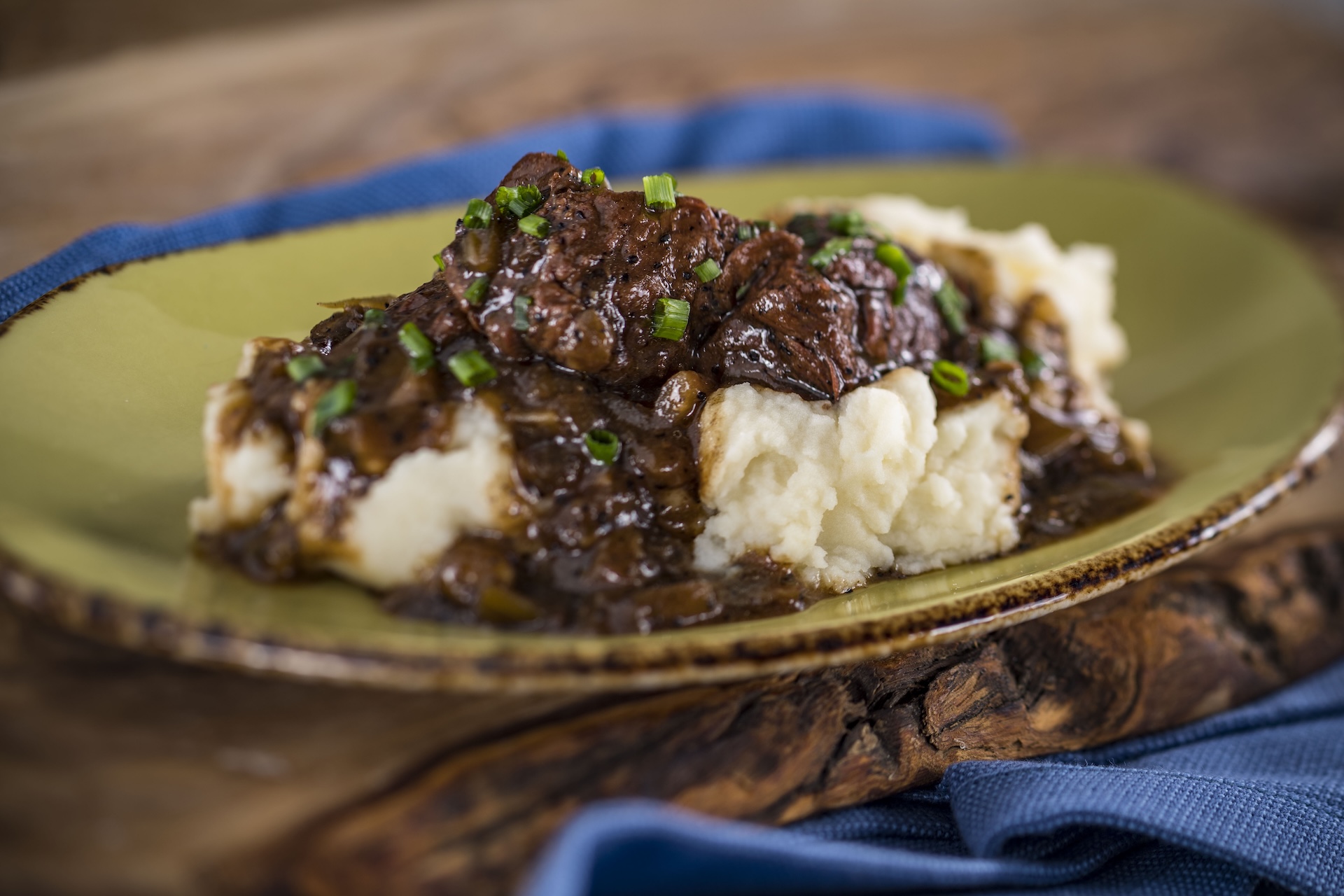 Beer-braised Beef served with smoked gouda mashed potatoes  