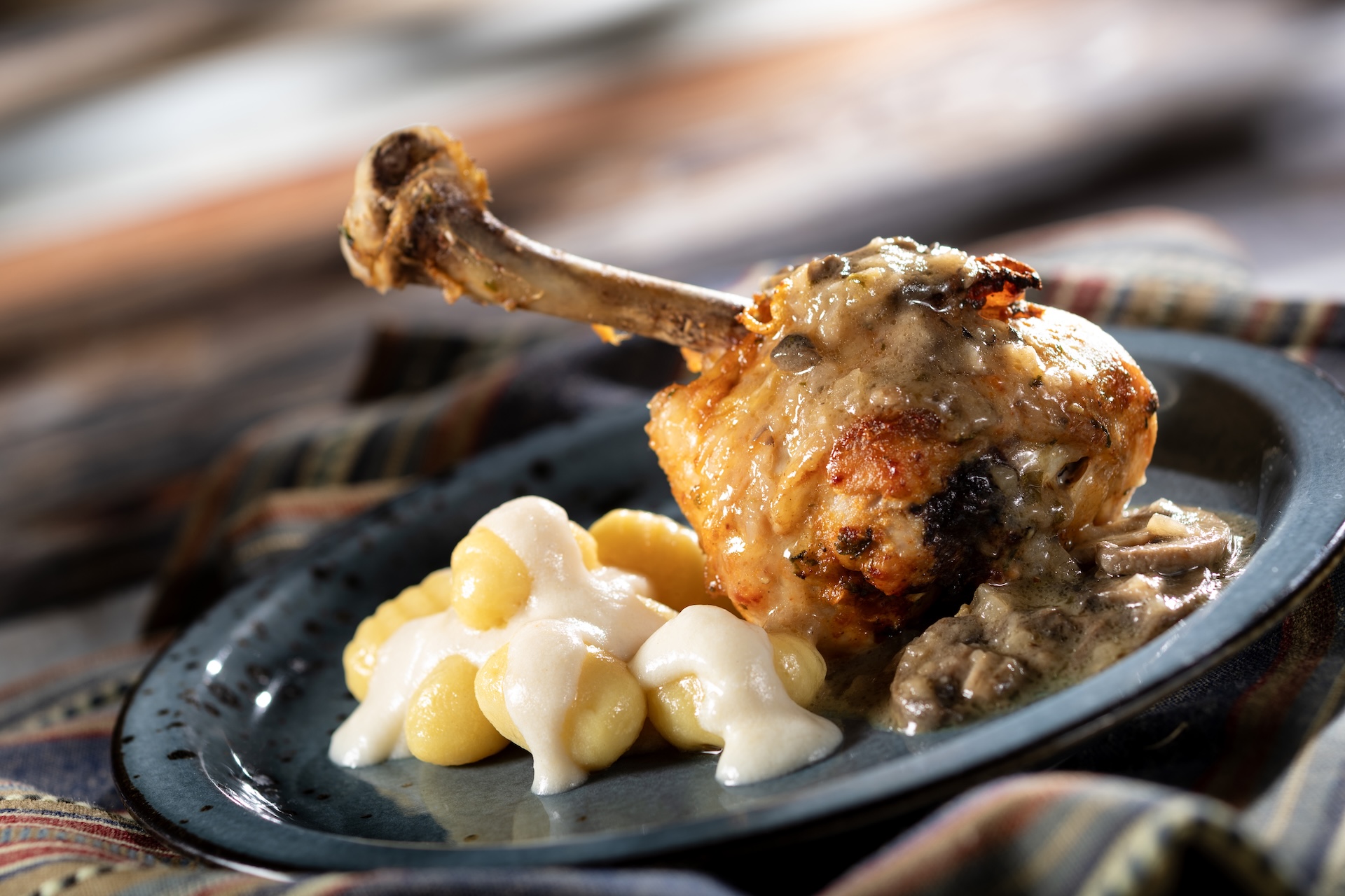 Pollo al Marsala: Roasted chicken drumstick, creamy potato gnocchi, mushrooms, and Marsala sauce (Introduced in 2014) (New)