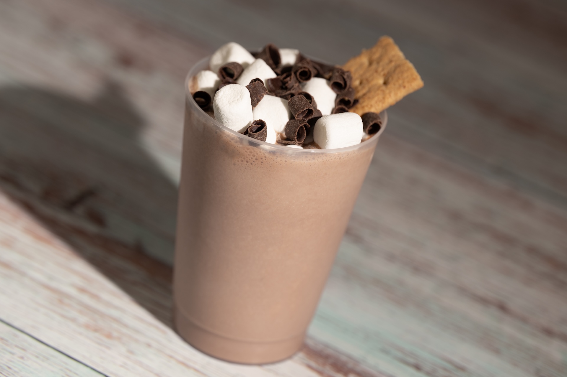 Frozen S'mores: Chocolate milk shake with marshmallow syrup topped with mini marshmallows, chocolate shavings, and a graham cracker (non-alcoholic) 