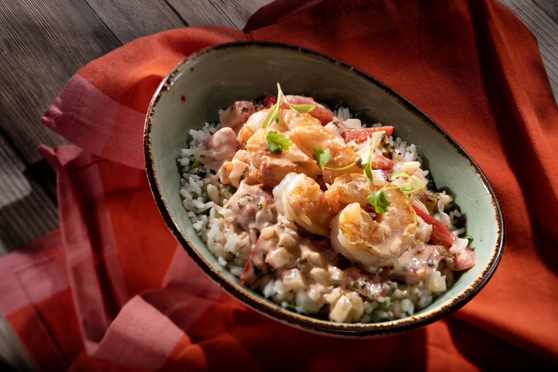 Moqueca de Camar&atilde;o: Plancha-seared shrimp, bell peppers, cilantro, and tomatoes in a rich coconut milk broth featuring BEN&rsquo;S ORIGINAL Long Grain White Rice (New) 