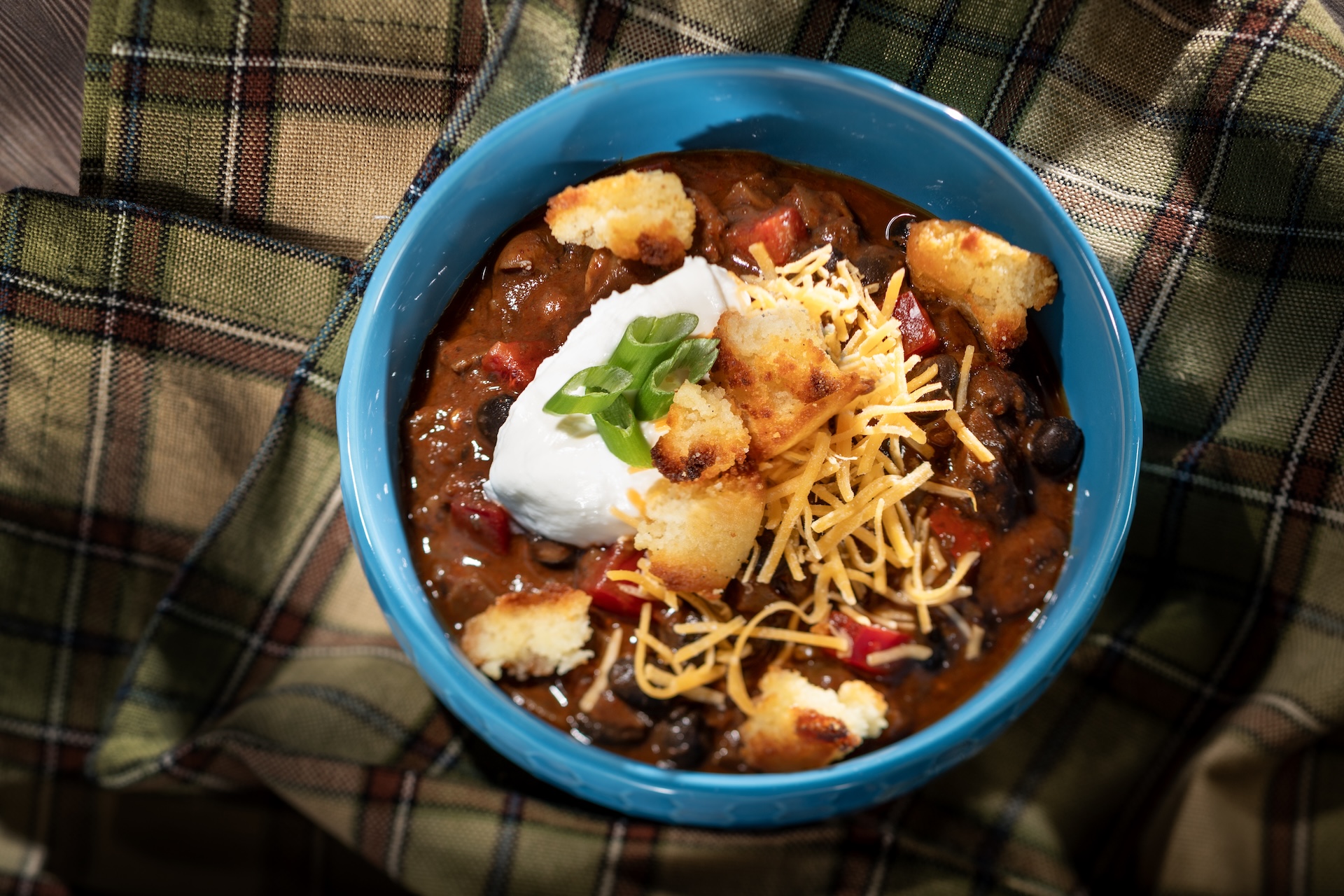 Spicy Black Bean-Mushroom Chili with plant-based sour cream, plant-based cheddar, and cornbread croutons (Plant-based) (New)  