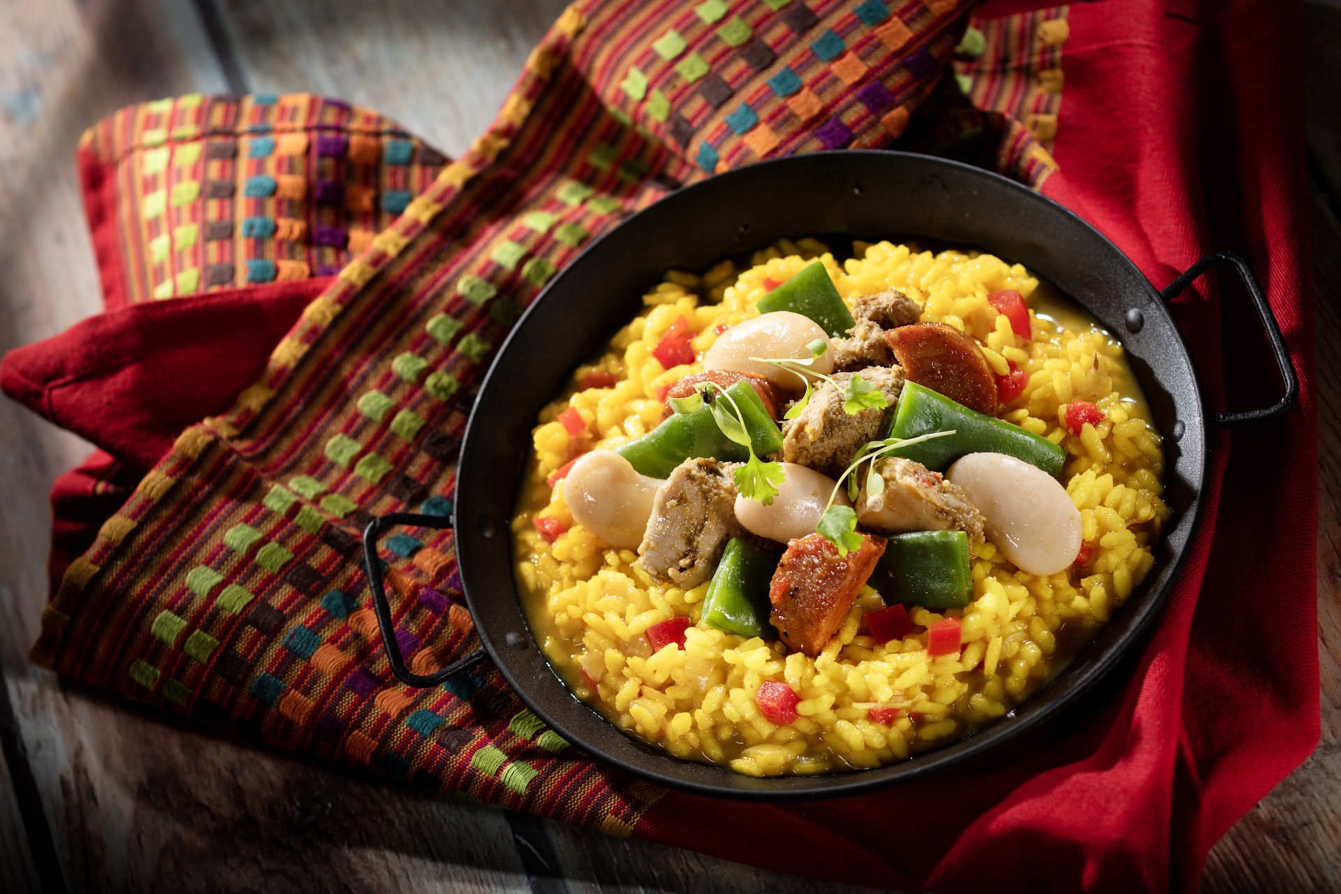 Paella Caldoso: Chicken, chorizo, gigante beans, romano beans, and saffron rice (Introduced in 1997) (New) 