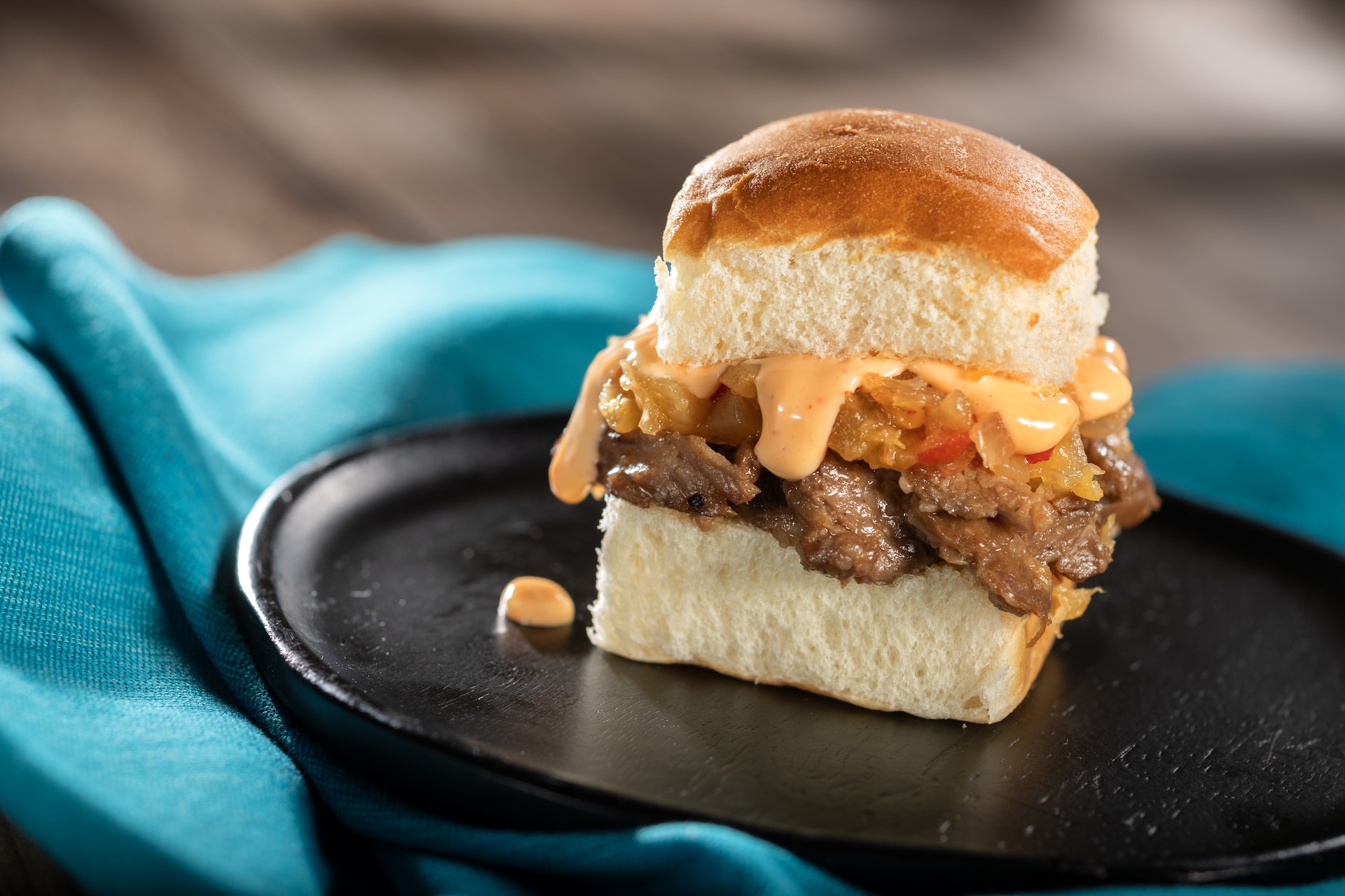 Slow-roasted Pork Slider with sweet-and-sour chutney featuring DOLE Pineapple and spicy mayonnaise on a Hawaiian roll (Introduced in 2012)  
