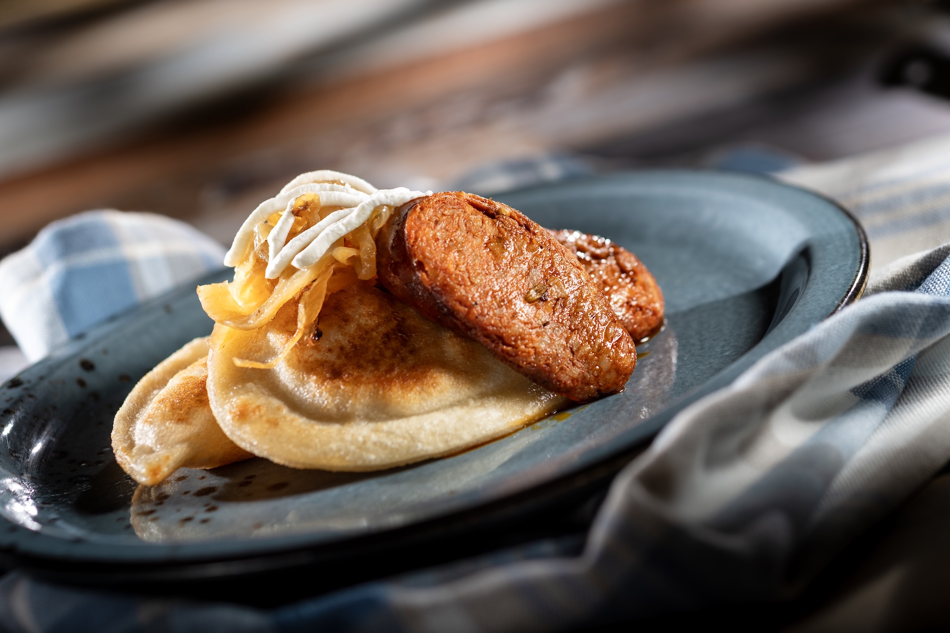 Potato Pierogi with kielbasa, caramelized onions, and sour cream (Introduced in 1996 at Poland)  