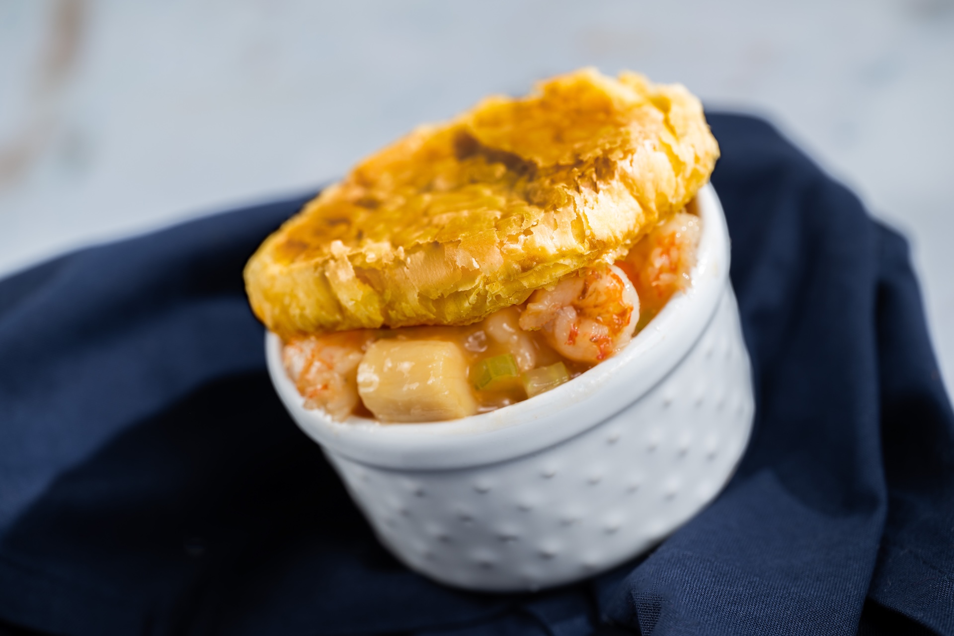 Seafood Pot Pie with shrimp, scallops, and lobster bisque topped with puff pastry  