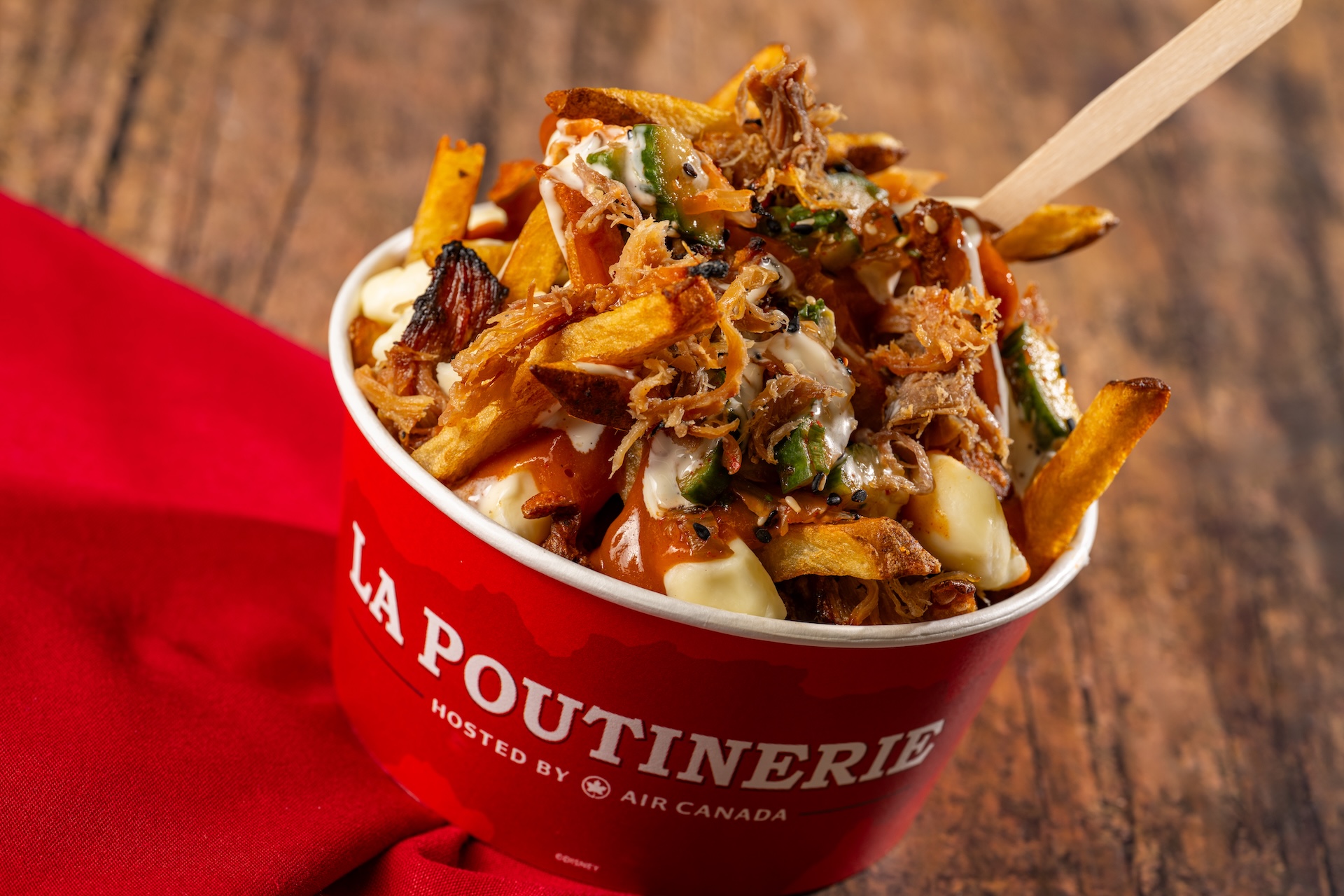 Seoul, South Korea: Bo Ssam Pork Poutine: French fries, cheese curds, bo ssam pork, gochujang gravy, kimchi pickles, a&iuml;oli, and sesame (New)