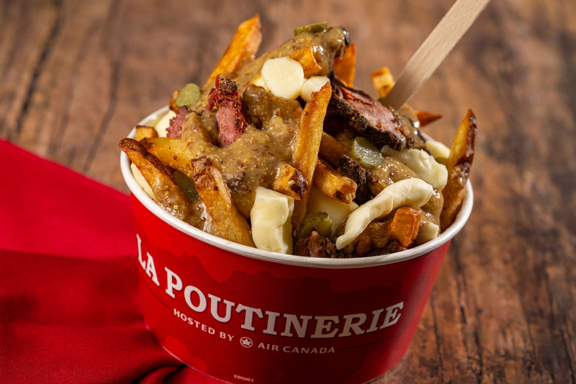 Seoul, South Korea: Bo Ssam Pork Poutine: French fries, cheese curds, bo ssam pork, gochujang gravy, kimchi pickles, a&iuml;oli, and sesame (New)  