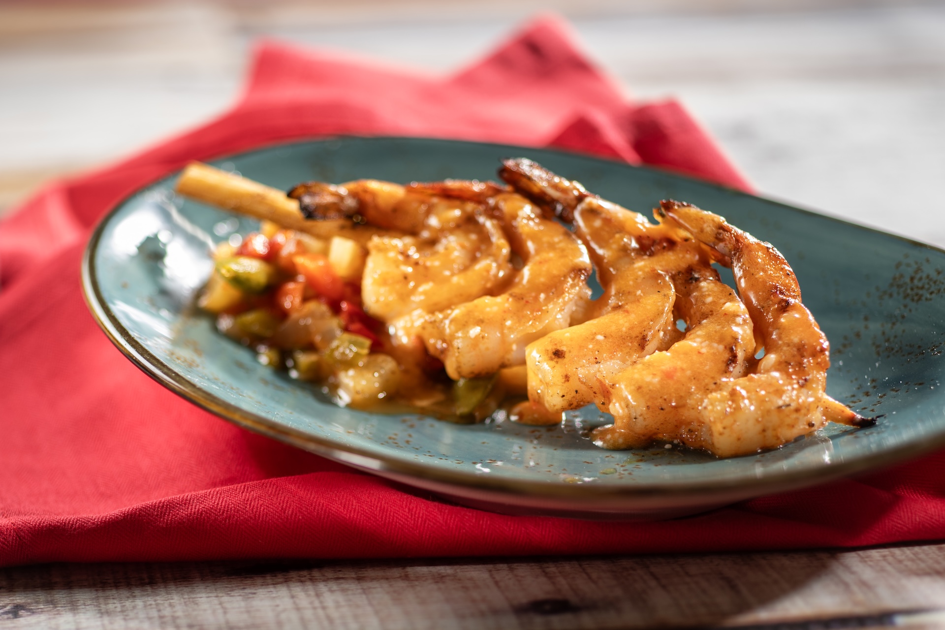 Grilled Bushberry-spiced Shrimp Skewer with sweet-and-sour vegetables and coconut-chili sauce  