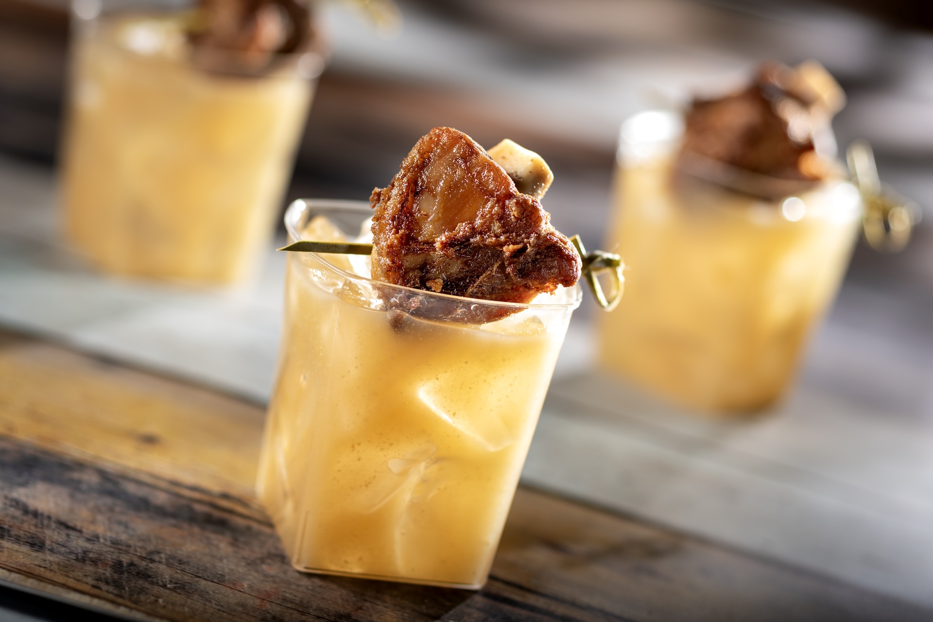 Swine Brine: Jim Beam Kentucky Straight Bourbon Whiskey, apple-cinnamon cider, lemon juice, and Dijon mustard topped with a pork wing 