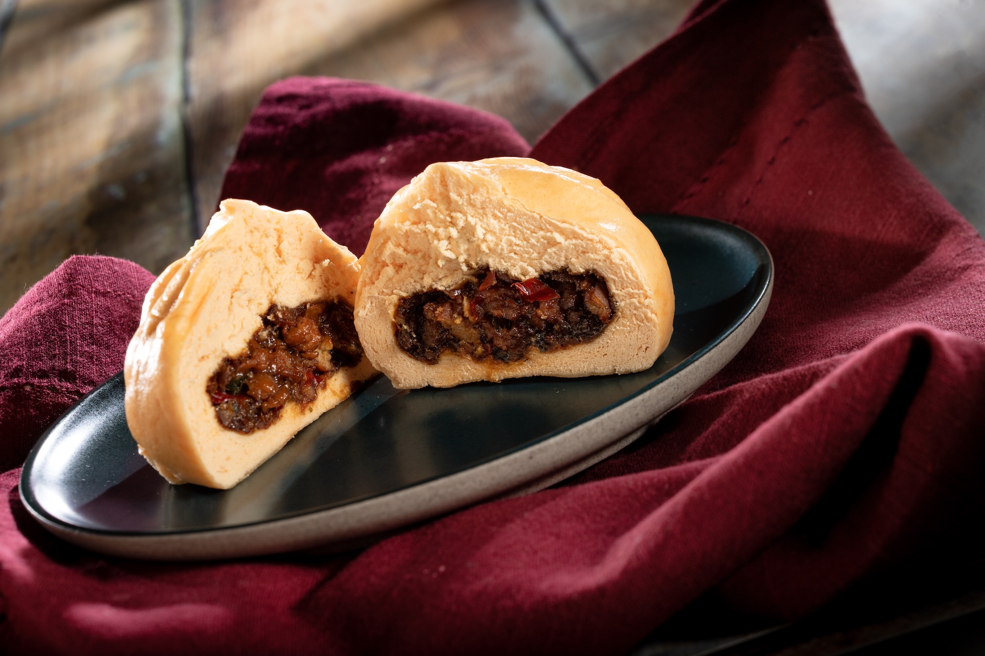 Teriyaki Chicken Bun: Steamed bun filled with minced chicken, vegetables, and teriyaki sauce  