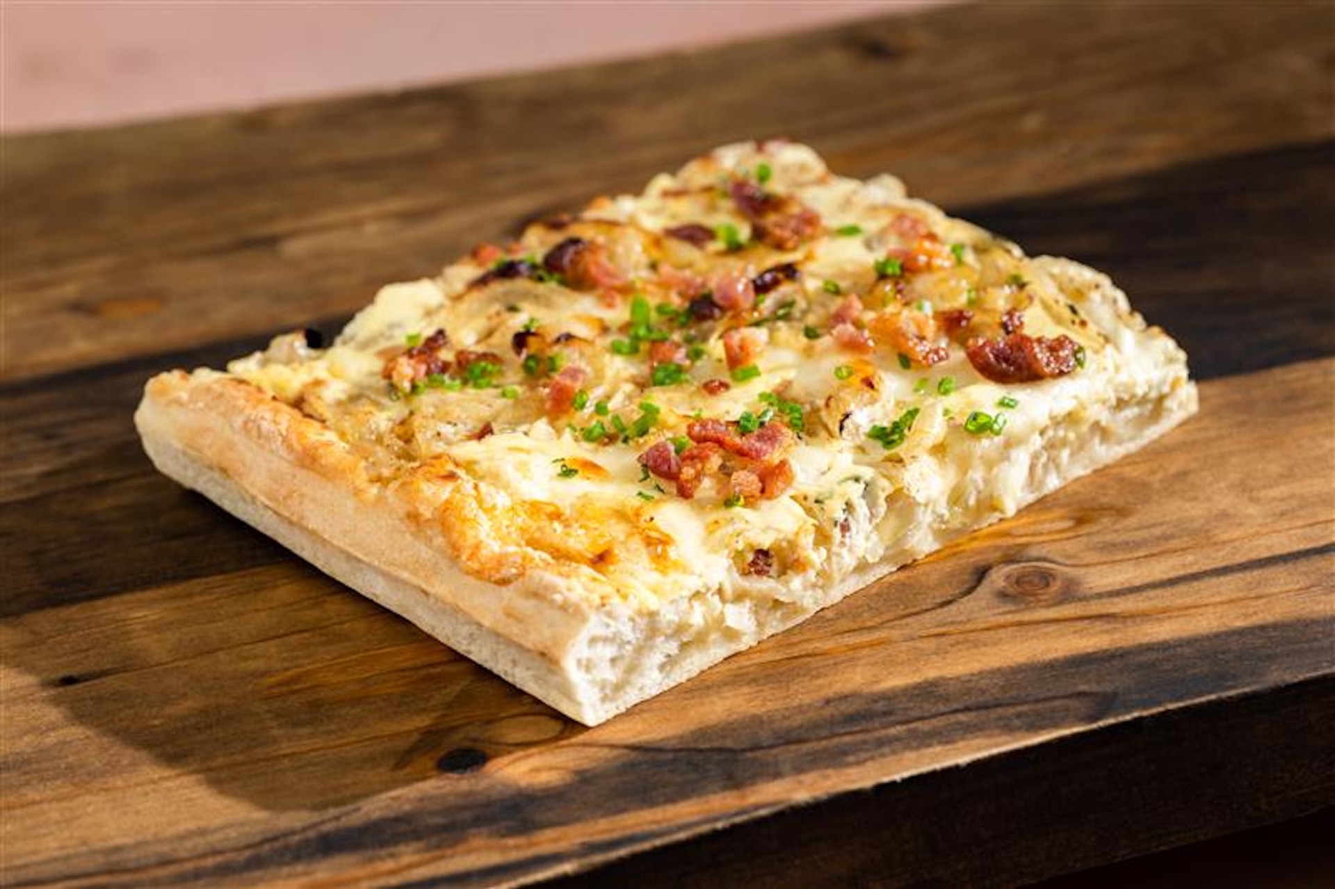 Zwiebelkuchen: German onion cake with caramelized onions, bacon, herbs, and a savory custard  