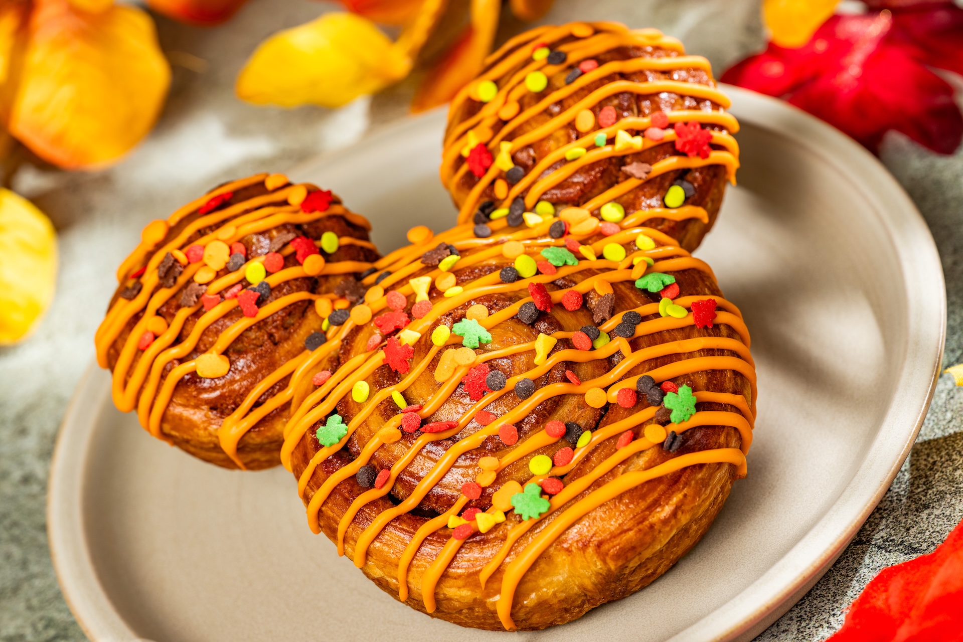 Fall Mickey Cinnamon Roll with orange icing 