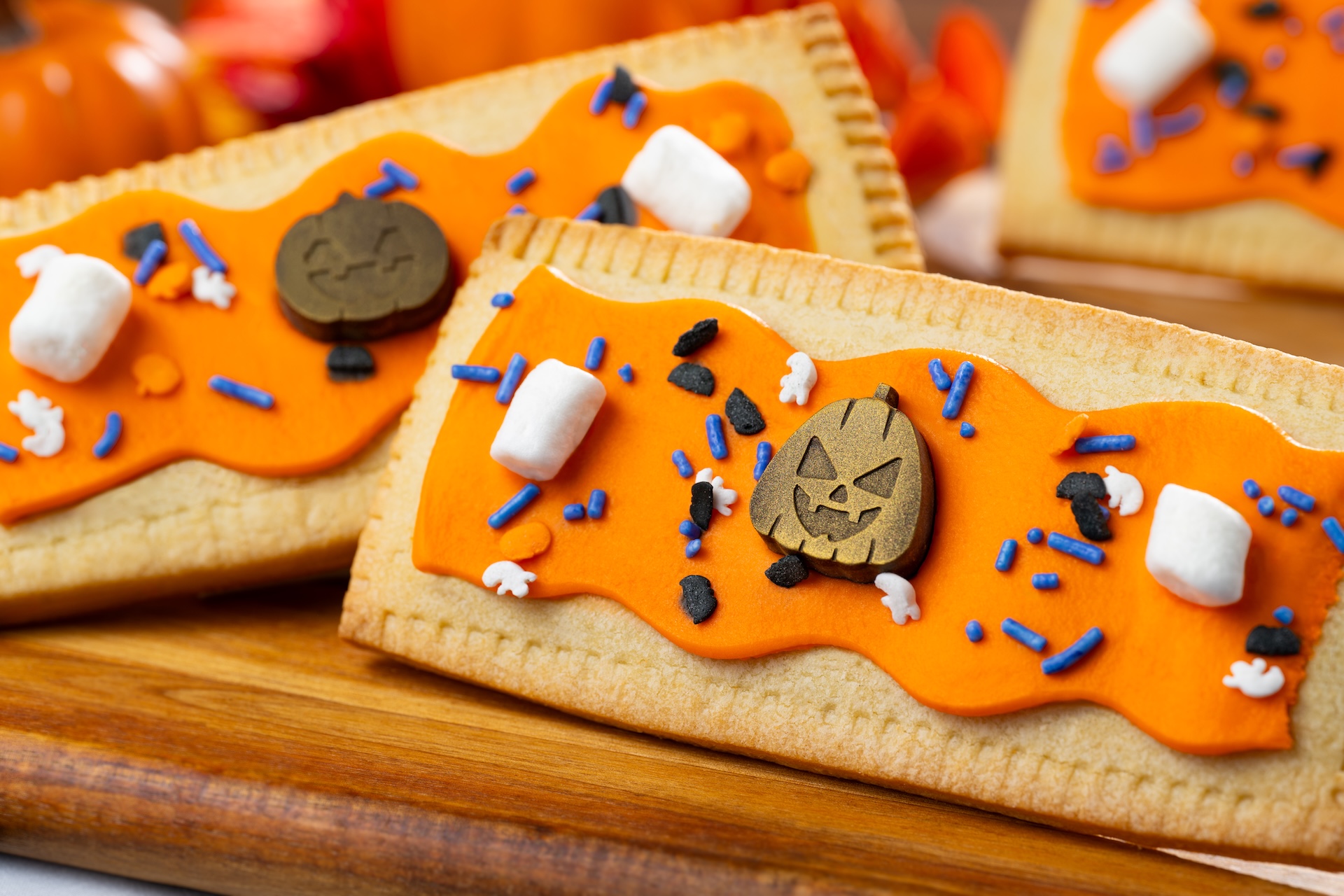 Pumpkin Lunch Box Tart: Pumpkin pie-filled pastry tart with marshmallow fondant, Halloween sprinkles,  marshmallows, and chocolate jack-o'-lanterns 