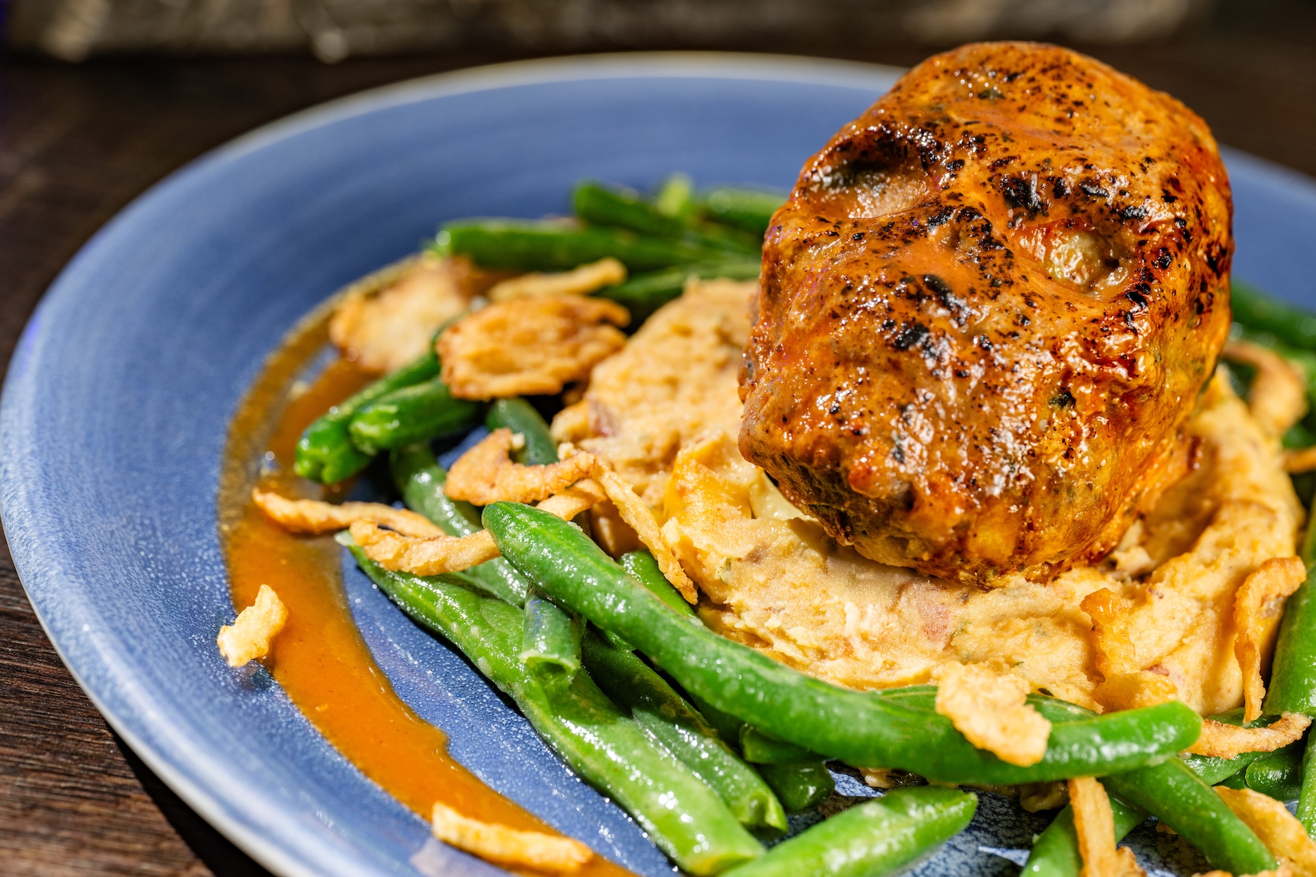 Skull Meatloaf: Caribbean-style glazed meatloaf served with mashed potatoes and seasonal vegetables 
