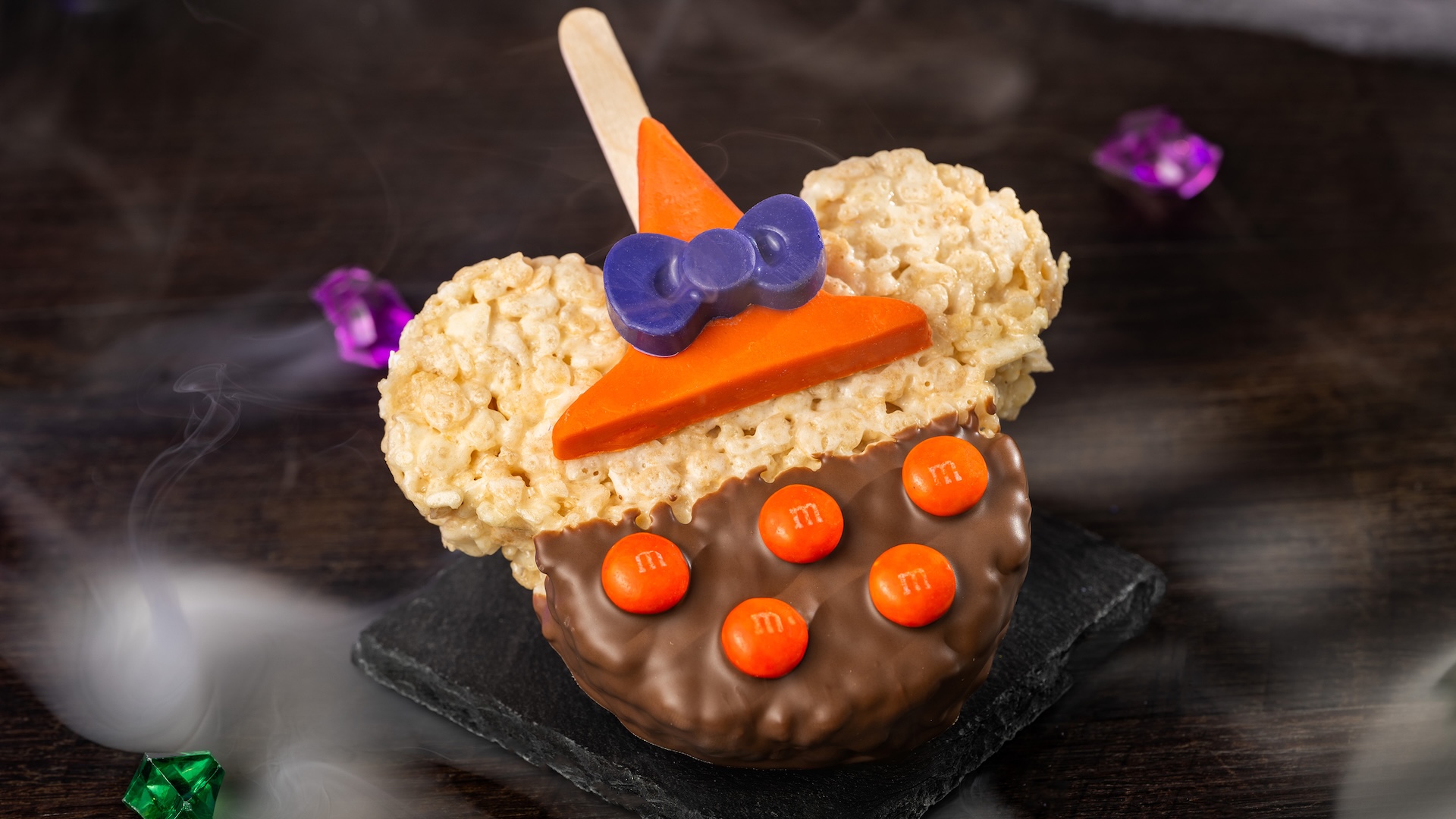 Minnie Witch Cereal Treat with M&M&rsquo;S Milk Chocolate Candies: Crisped rice cereal treat with milk chocolatey coating, M&M'S milk chocolate candies, and chocolatey witch hat  