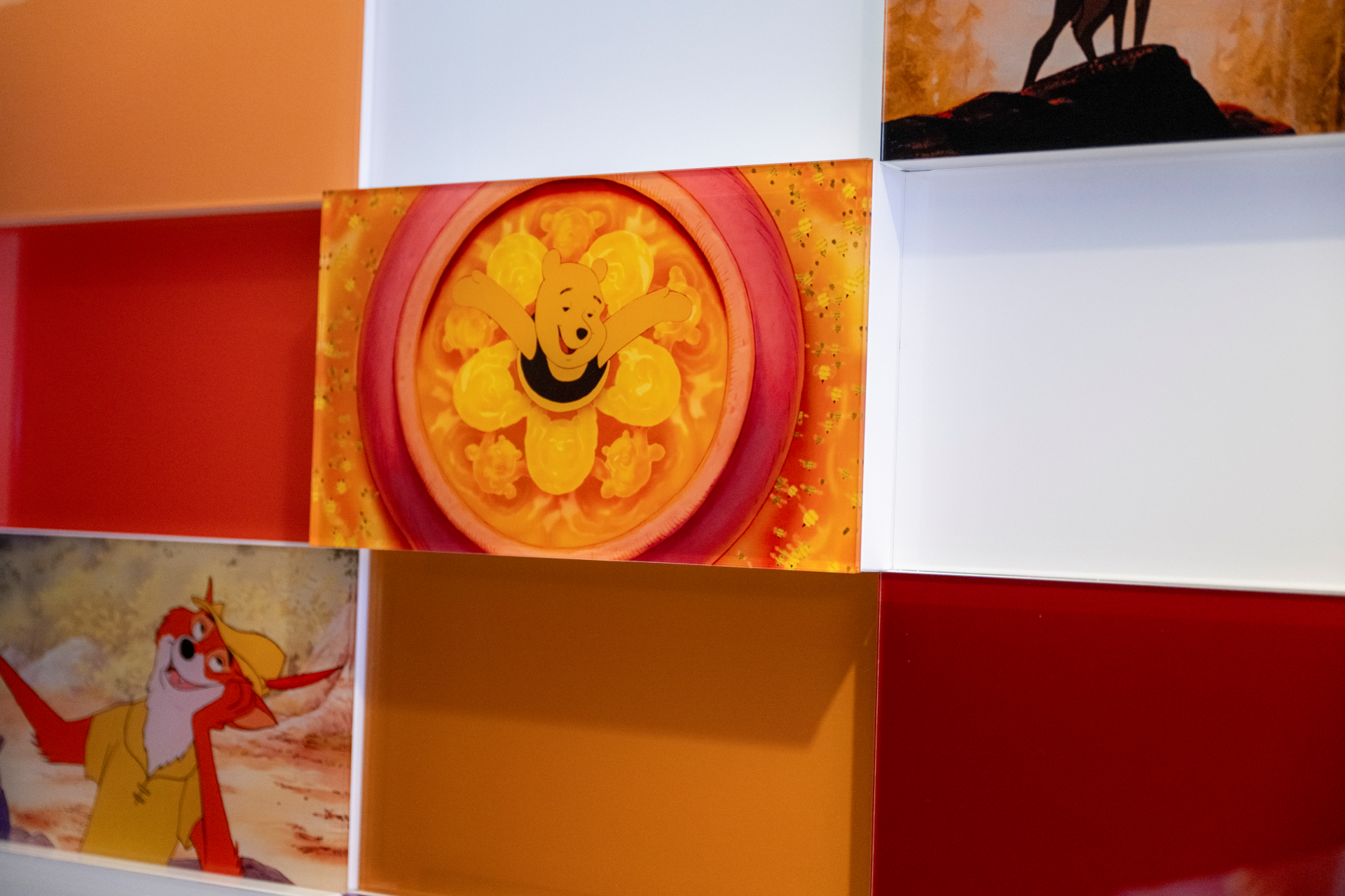 Colorful tiles featuring Disney characters, including Winnie the Pooh and others.