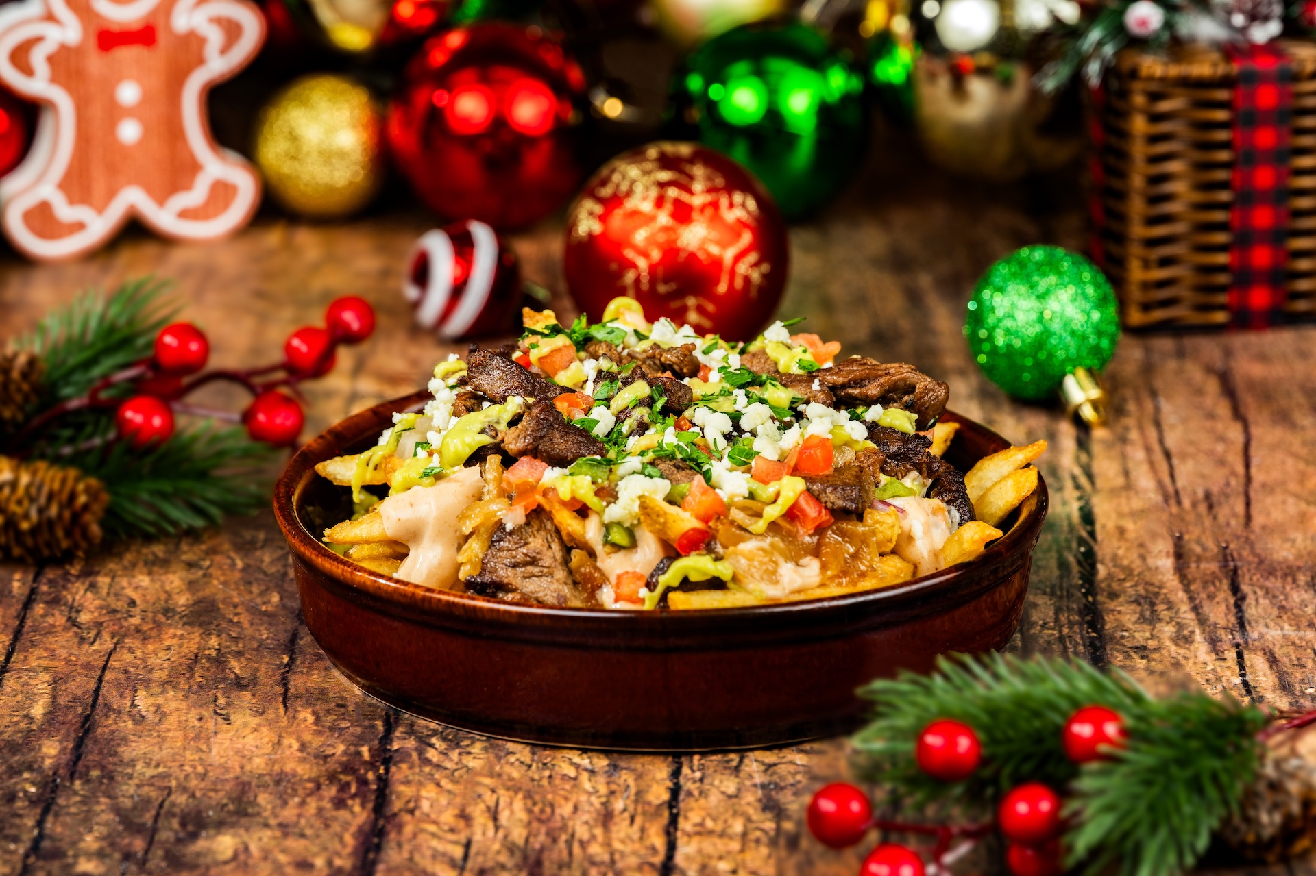 Carne Asada Loaded Fries with chipotle queso, caramelized onions, avocado salsa, and queso fresco (Available during Mickey&rsquo;s Very Merry Christmas Party only) 
