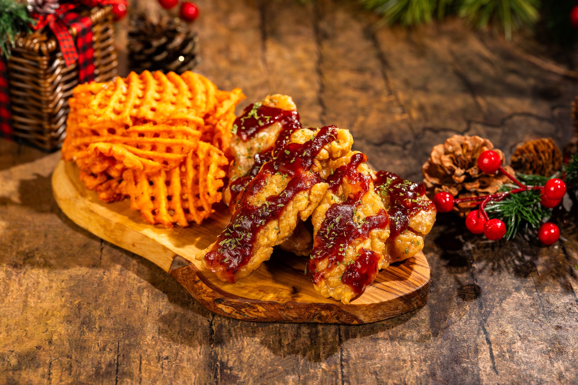 Yuletide Chicken Strips with sage butter and cranberry barbecue glaze served with sweet potato waffle fries (Available during Mickey&rsquo;s Very Merry Christmas Party only) 