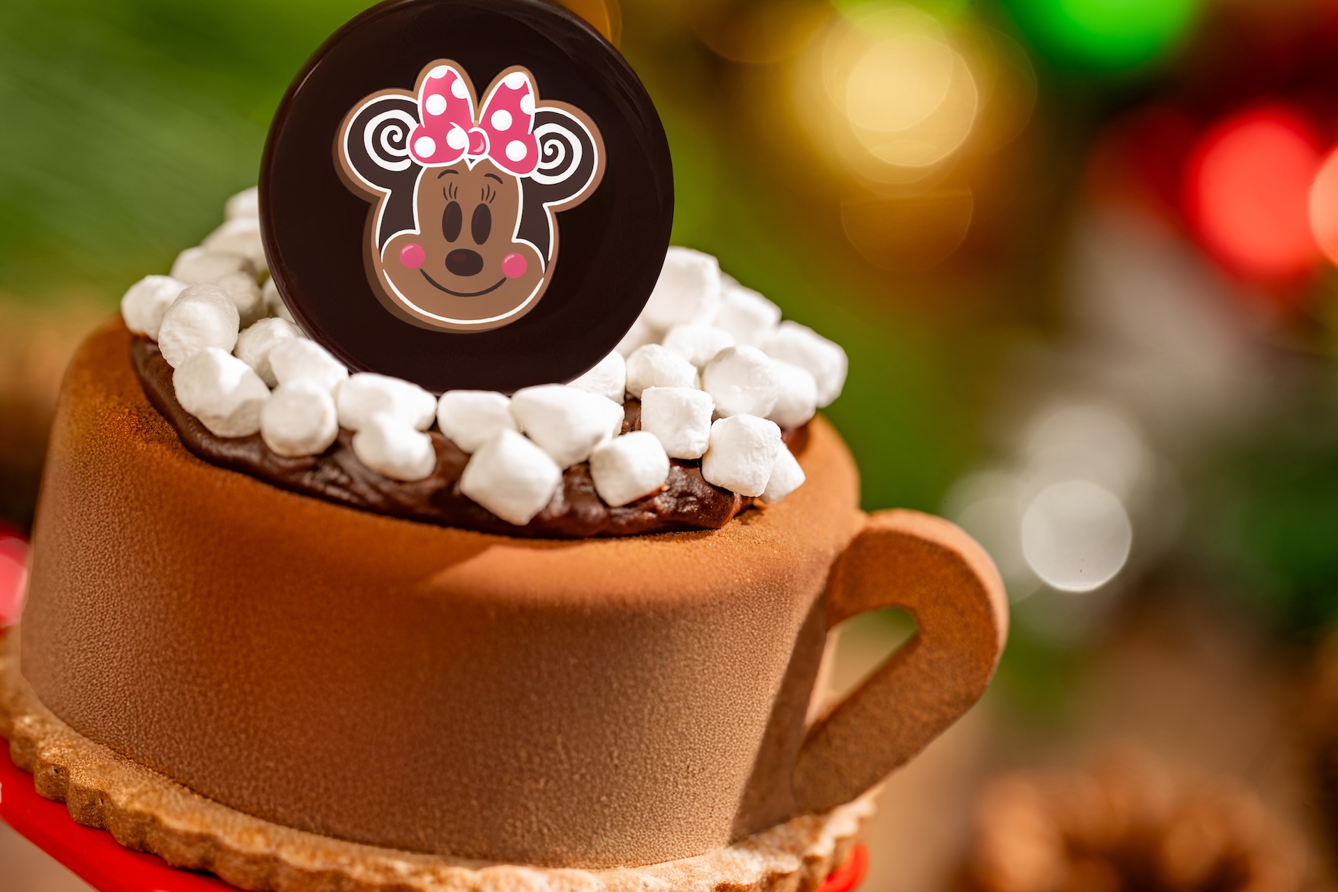 Minnie Cocoa Cake: Chocolate mousse, marshmallow filling, and chocolate cake with chocolate d&eacute;cor (New) (Available during Mickey&rsquo;s Very Merry Christmas Party only) 