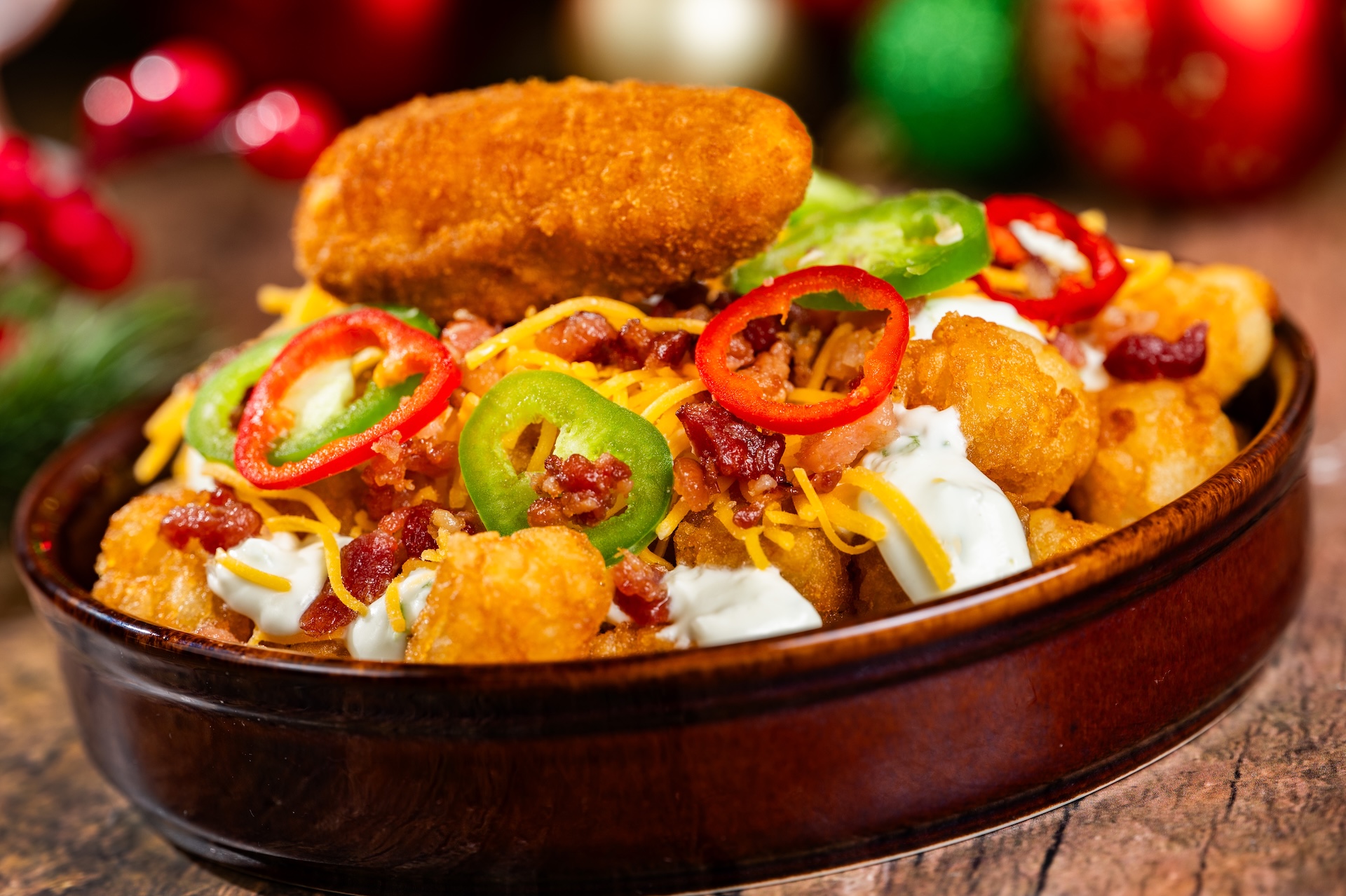 Jalape&ntilde;o Popper Tots: Jalape&ntilde;o cream cheese, bacon, and cheddar topped with a jalape&ntilde;o popper (Available during Mickey&rsquo;s Very Merry Christmas Party only) 