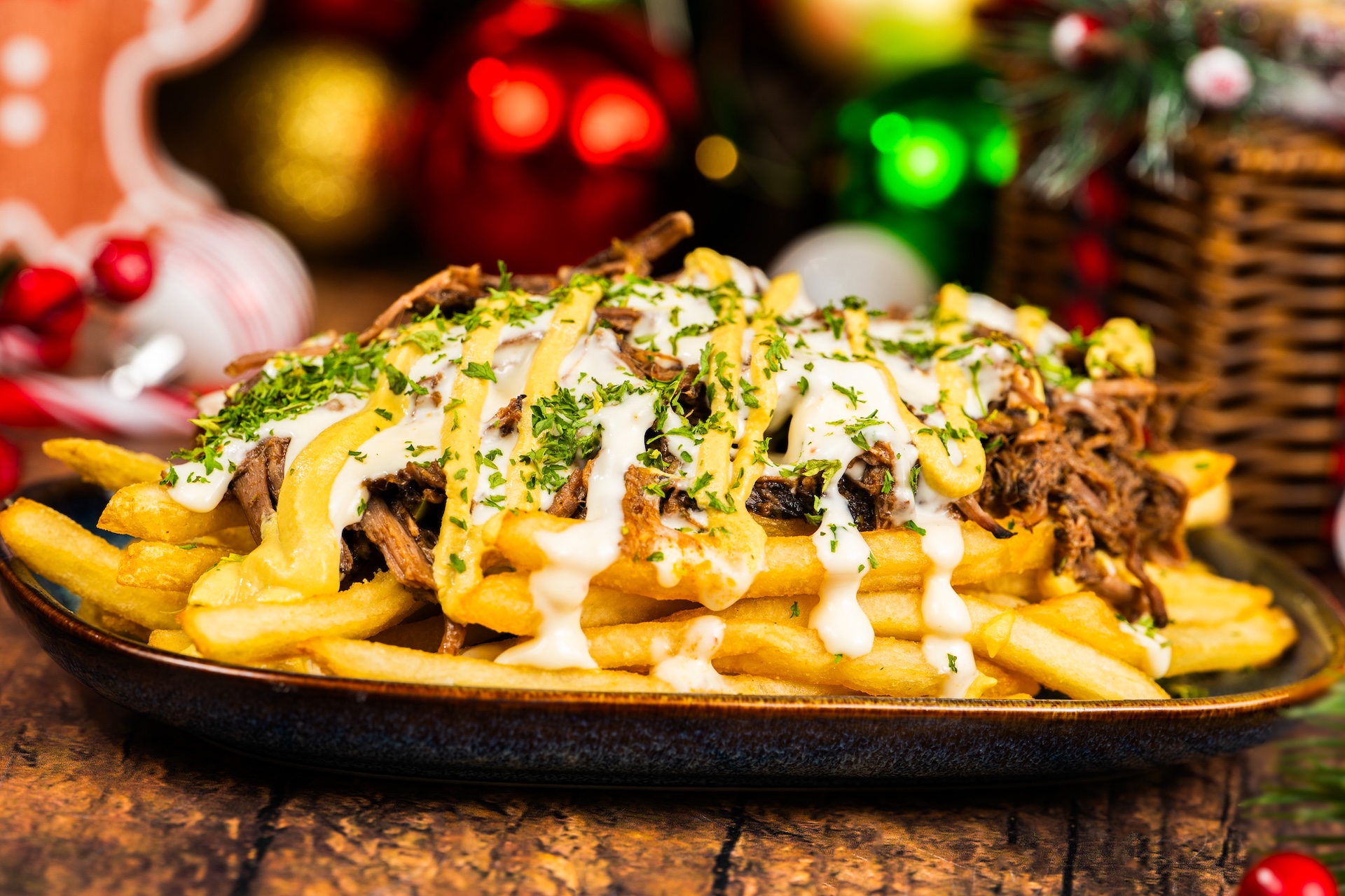 Holiday Pot Roast Loaded French Fries topped with pot roast, beer-cheese sauce, crispy onions, and horseradish mustard (Available during Mickey&rsquo;s Very Merry Christmas Party only) 