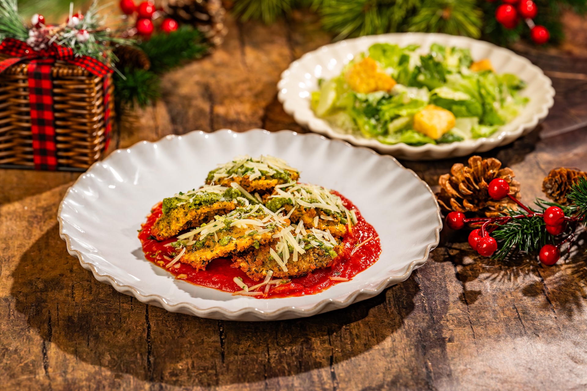 Holiday Ravioli: Fried ravioli with marinara, basil pesto, Parmesan, and parsley served with a side Caesar salad (Available during Mickey&rsquo;s Very Merry Christmas Party only) 