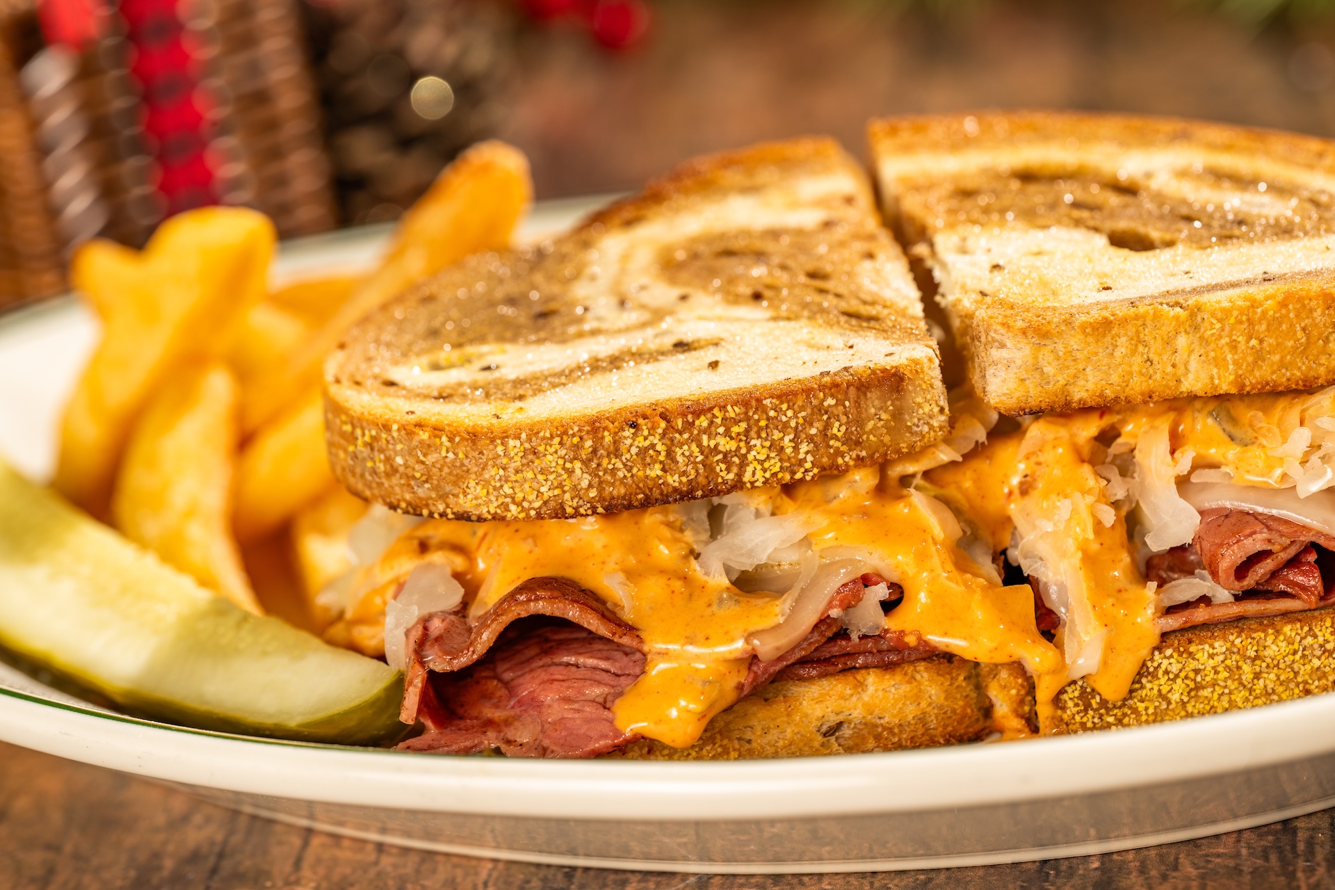 Classic Reuben Sandwich with sauerkraut, Swiss cheese, Thousand Island dressing, and griddled rye (New) (Available during regular park hours Nov. 1, 2026, through Jan. 2, 2027, and during Mickey&rsquo;s Very Merry Christmas Party; reservations recommended) 