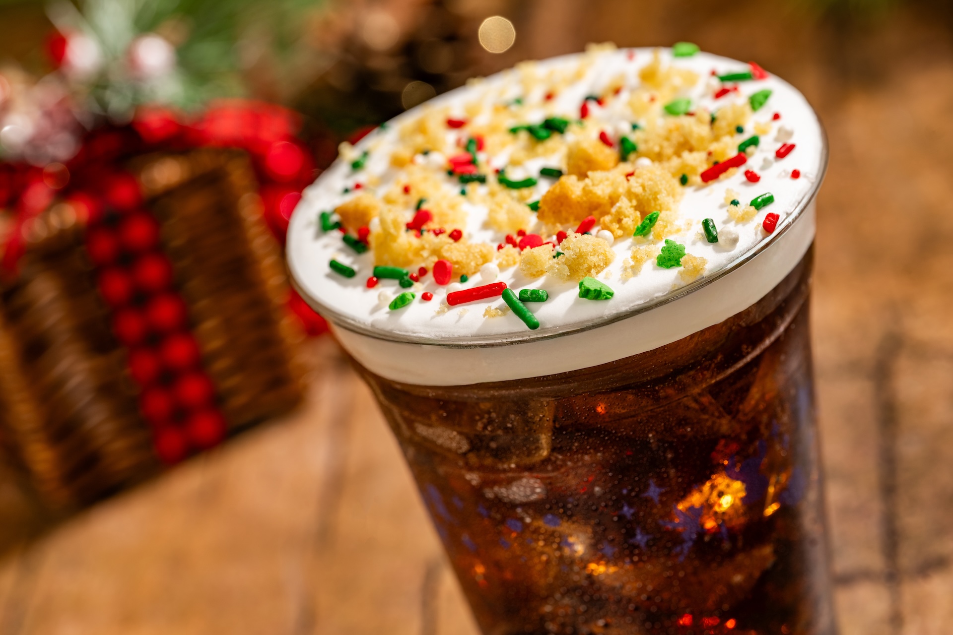 Sugar Cookie Soda: Coca-Cola with cookie butter syrup, cookie butter cold foam, sprinkles, and sugar cookie pieces (New) (Available during Mickey&rsquo;s Very Merry Christmas Party only) 